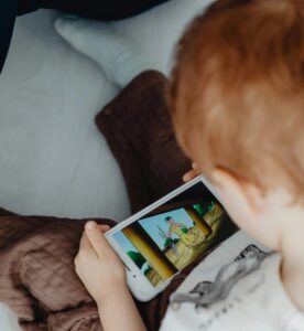child watching movie on screen