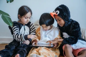 kids playing game on tablet together